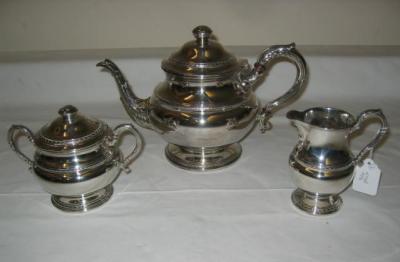 Appraisal: A THREE PIECE TEA SET of baluster form with laurel