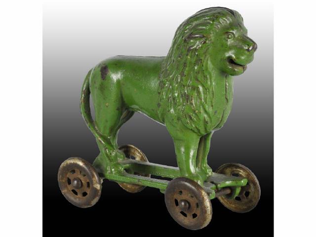 Appraisal: Cast Iron Lion on Wheels Still Bank Description Made by