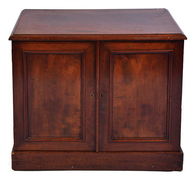 Appraisal: A VICTORIAN MAHOGANY TABLE CABINET with twin panelled doors enclosing