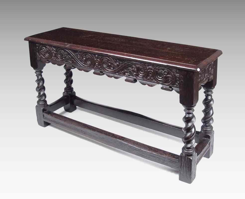 Appraisal: CARVED JACOBEAN OAK BENCH Carved skirt twist legs carved stretchers