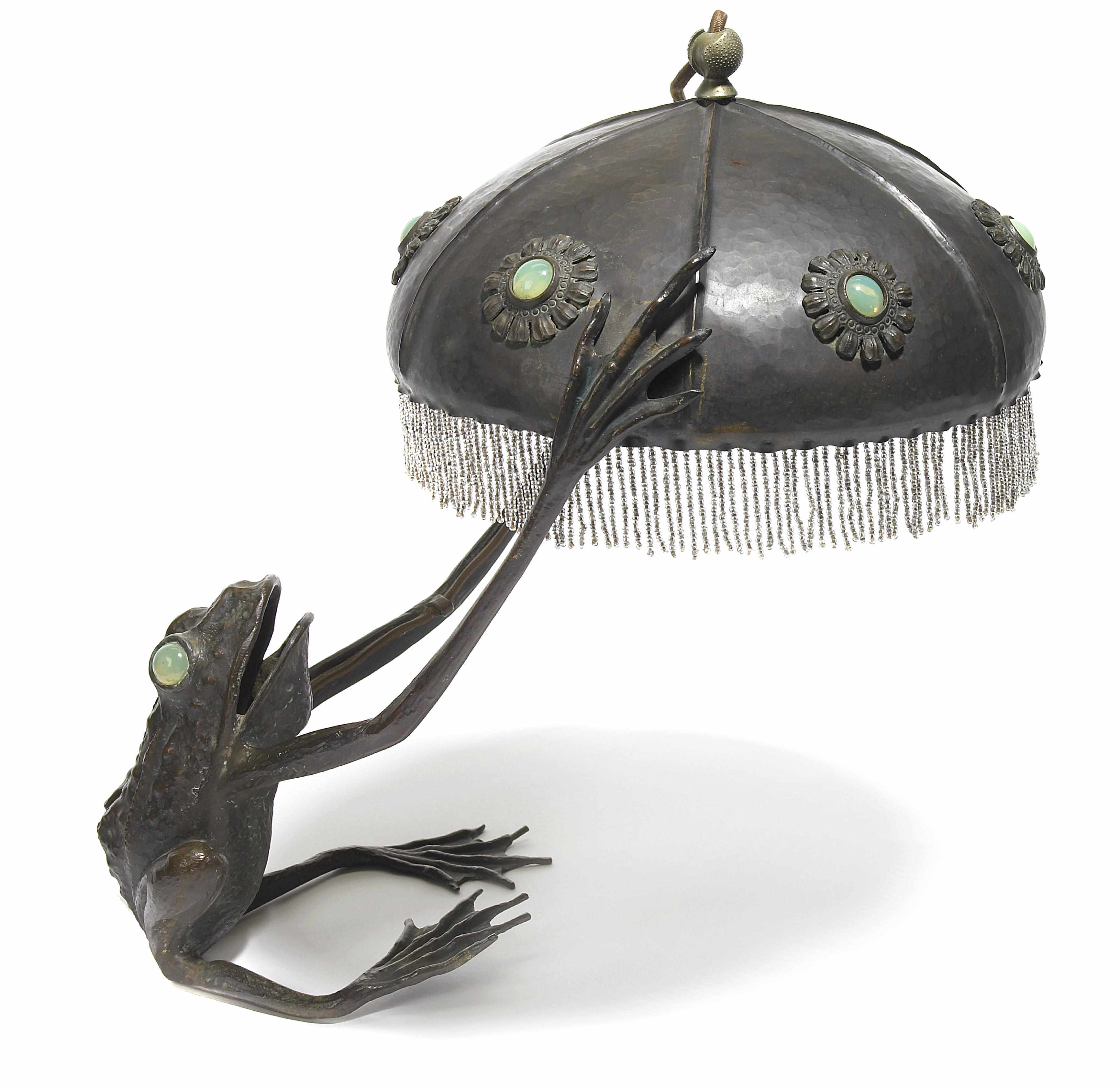 Appraisal: An Austrian patinated bronze metal and opalescent glass Frog lamp