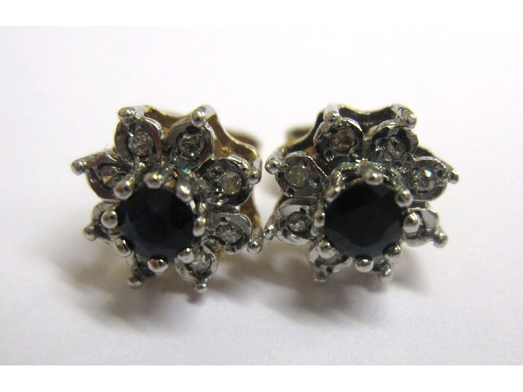 Appraisal: Pair of ct gold mounted sapphire and diamond cluster stud