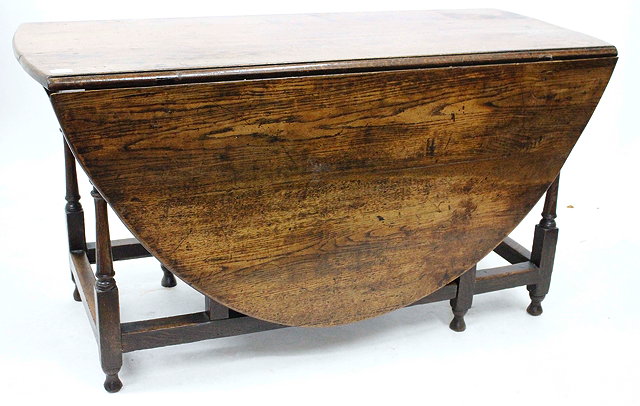 Appraisal: AN TH CENTURY OAK DROP LEAF GATE LEG TABLE with