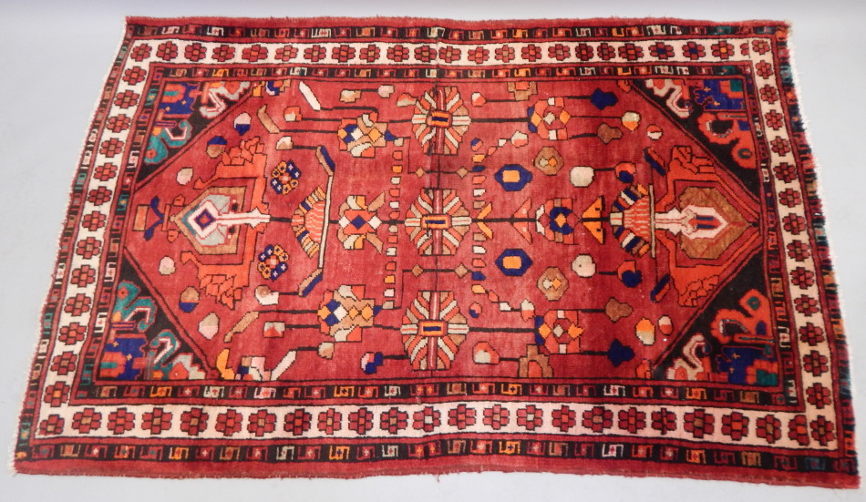 Appraisal: A Hamedan rug with a design in red and cream