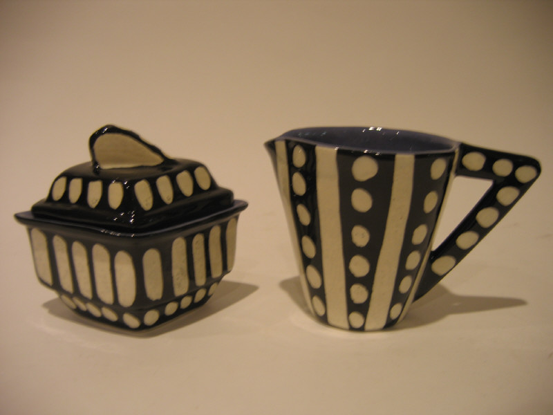 Appraisal: STUDIO CRAFT CREAMER AND SUGAR black and white decoration with