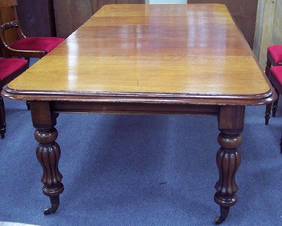 Appraisal: A Victorian mahogany dining table raised on waisted lotus carved