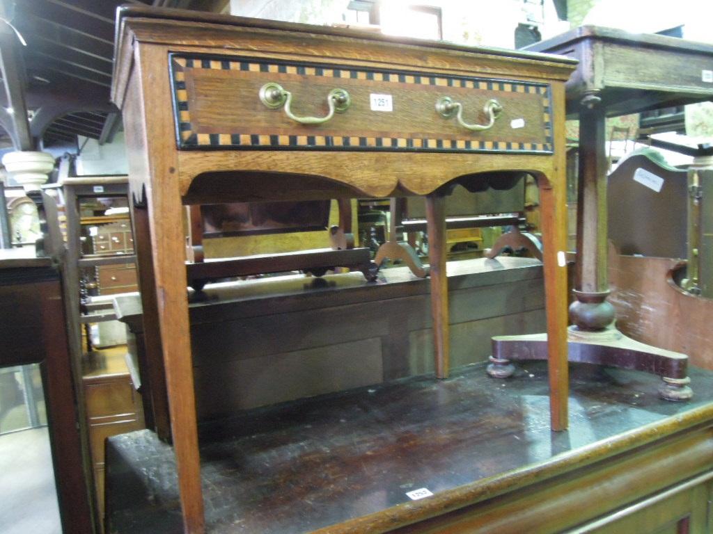 Appraisal: An antique oak side table fitted with a frieze drawer