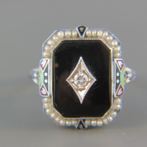 Appraisal: Diamond Ring carat in black onyx surrounded by seed pearls