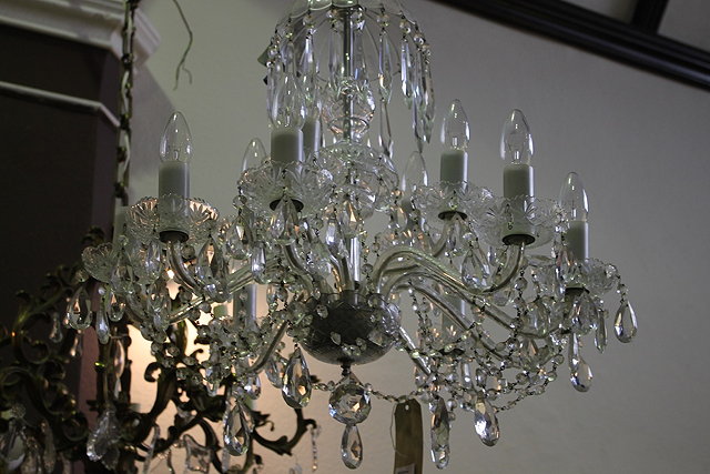 Appraisal: A GLASS EIGHT BRANCH CHANDELIER of tiered form with cut