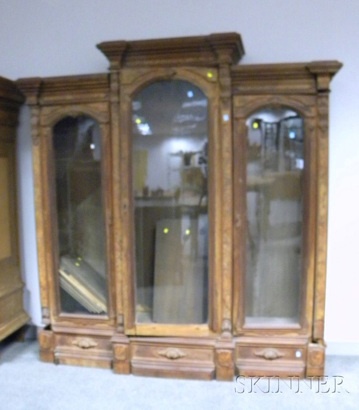 Appraisal: Victorian Renaissance Revival Carved Walnut Three-Door Bookcase Finish loss missing