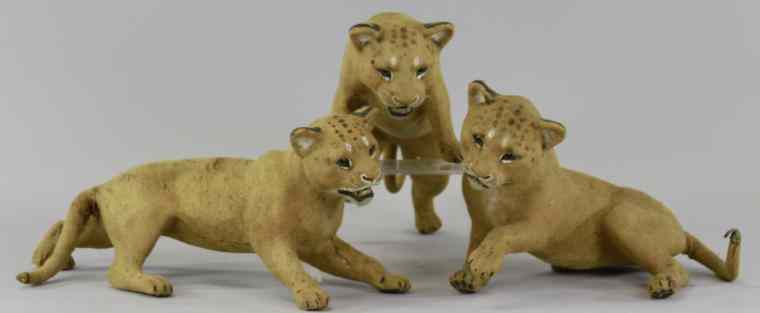 Appraisal: LOT OF THREE PAPIER M CH LION CUBS Cubs molded