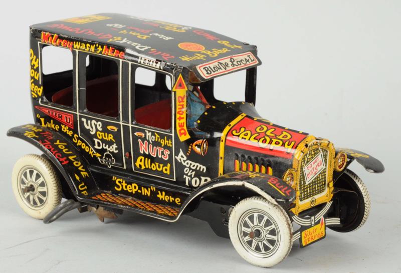 Appraisal: Marx Toys Tin Litho Old Jalopy Wind-Up Toy Has driver