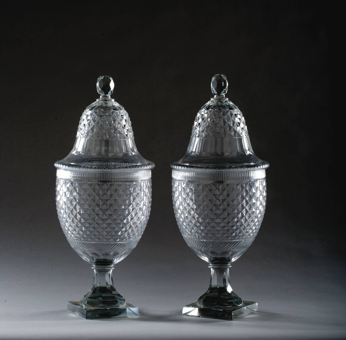 Appraisal: PAIR OF COLORLESS CUT-GLASS SWEETMEAT JARS AND COVERS Each cut