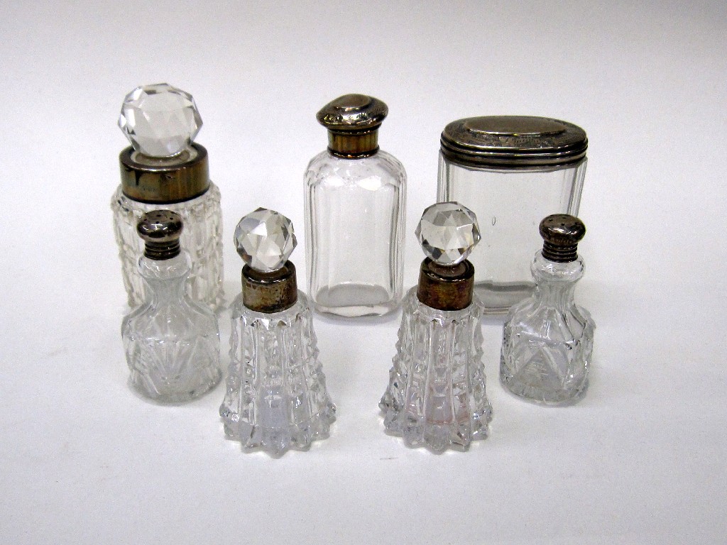 Appraisal: Lot comprising five silver topped and mounted dressing table jars