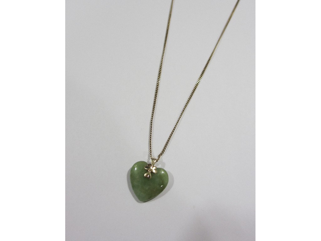 Appraisal: Gold mounted heart shaped jade pendant on ct gold neckchain