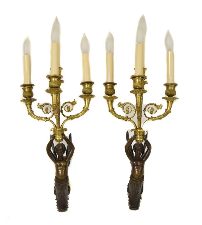 Appraisal: Pair of Gilt Bronze and Ebonized Sconces Pair of Gilt