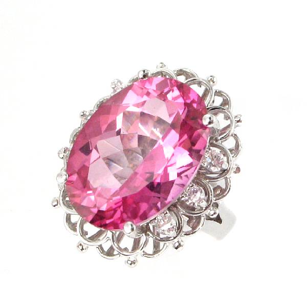 Appraisal: A pink topaz diamond and k white gold ring