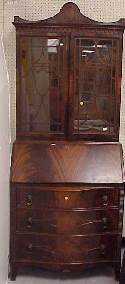 Appraisal: th C mahogany drop front secretary desk urn form on