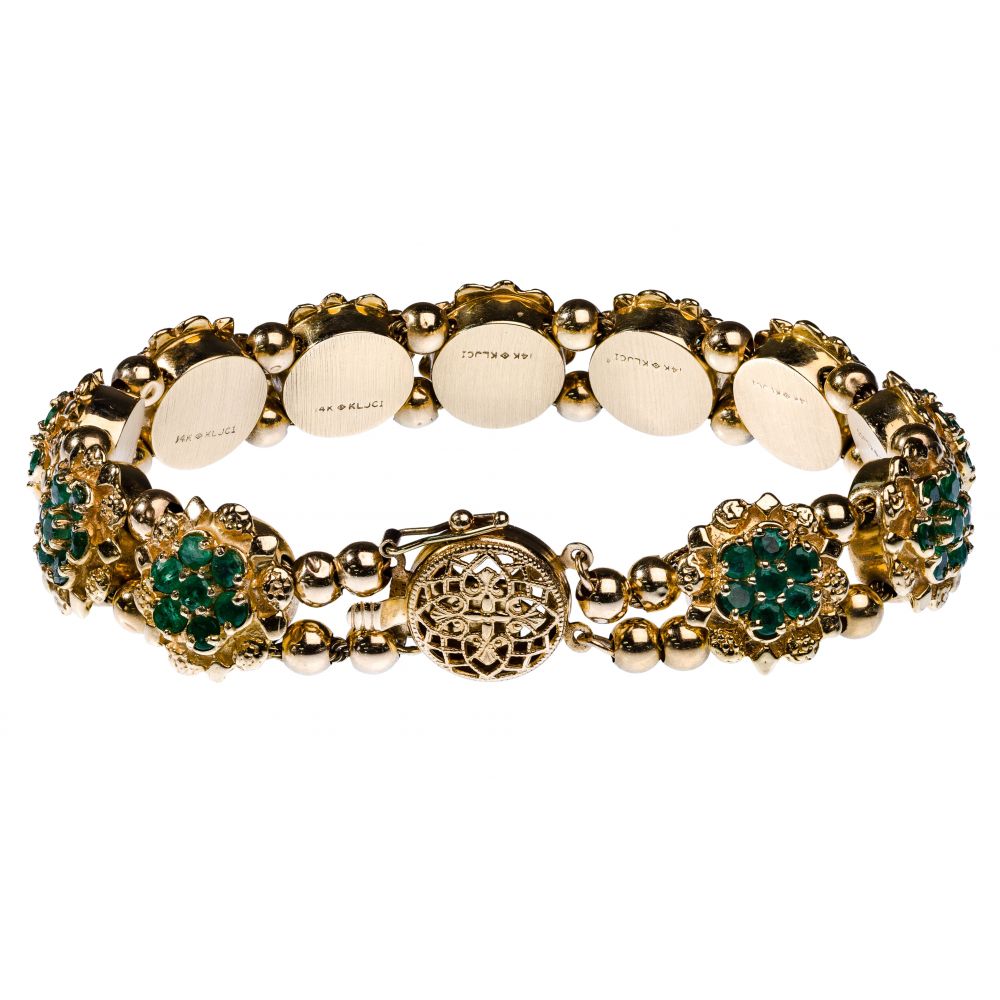 Appraisal: K YELLOW GOLD AND EMERALD BRACELETSlide bracelet having slides each