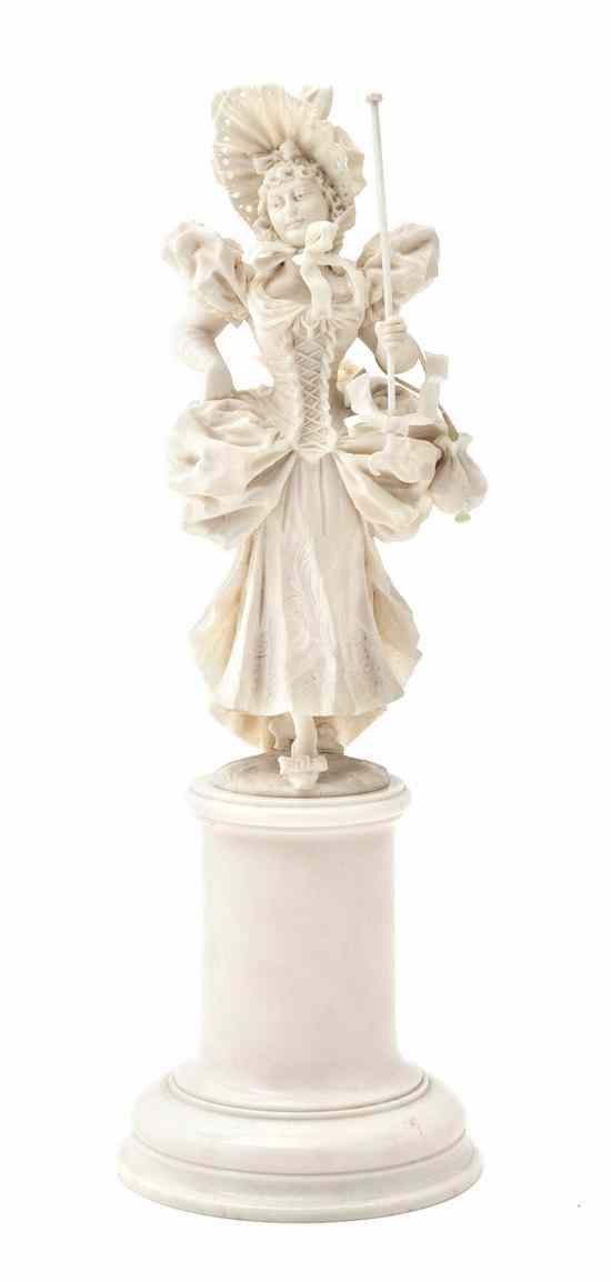 Appraisal: A Continental Carved Ivory Figure depicting a standing maiden in