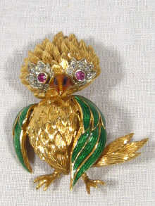 Appraisal: An carat yellow and white gold enamelled brooch in the