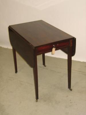 Appraisal: A MAHOGANY PEMBROKE TABLE the rounded oblong top on plain