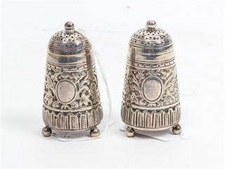 Appraisal: A Pair of Victorian Silver Casters Edward Hutton London the