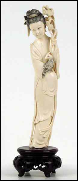 Appraisal: CHINESE CARVED IVORY FIGURE OF A QUAN YIN HOLDING FLOWERS