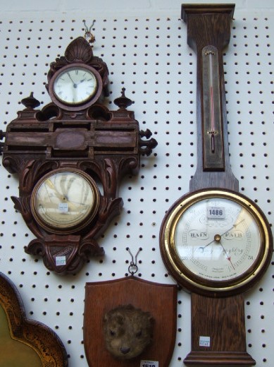 Appraisal: A Victorian carved walnut clock calendar and barometer compendium a