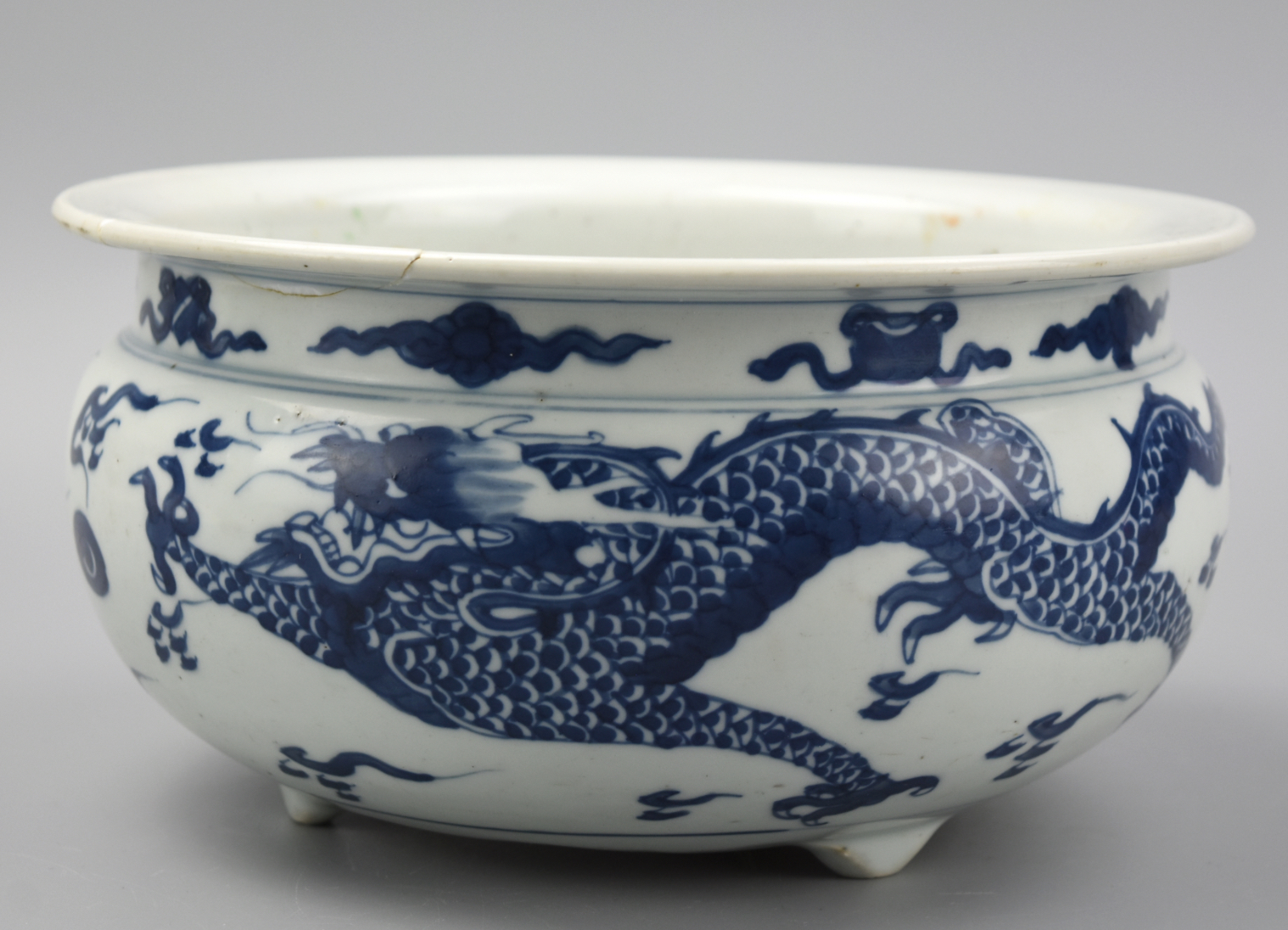 Appraisal: CHINESE BLUE WHITE TRIPOD DRAGON CENSER TH C a large