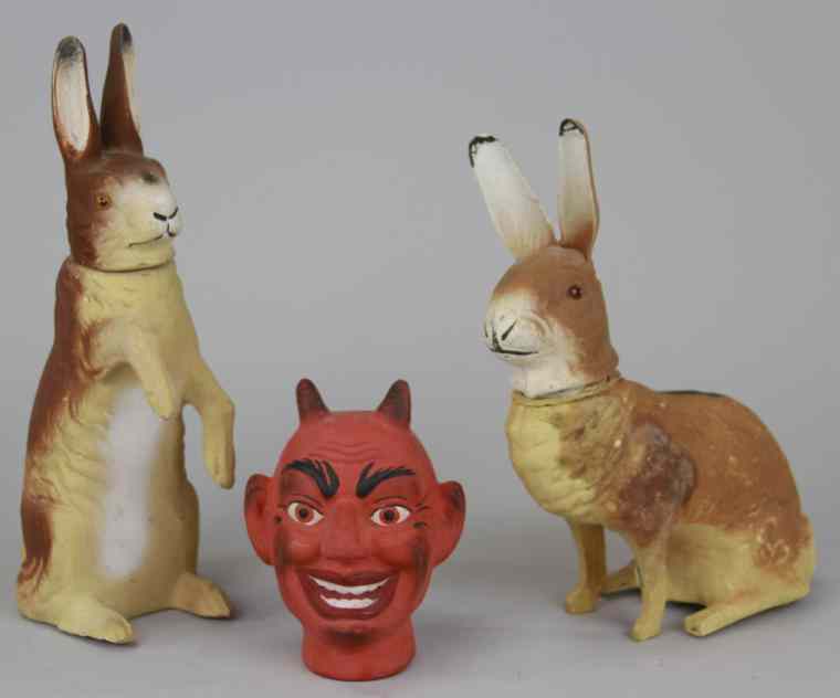 Appraisal: EASTER BUNNY CANDY CONTAINERS DEVIL HEAD Germany two rabbit candy