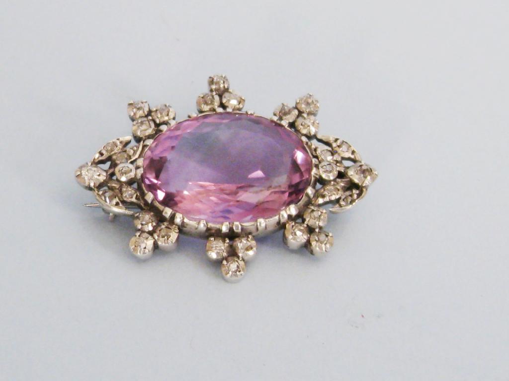 Appraisal: An Amethyst and Diamond Brooch the oval shaped amethyst collet-set