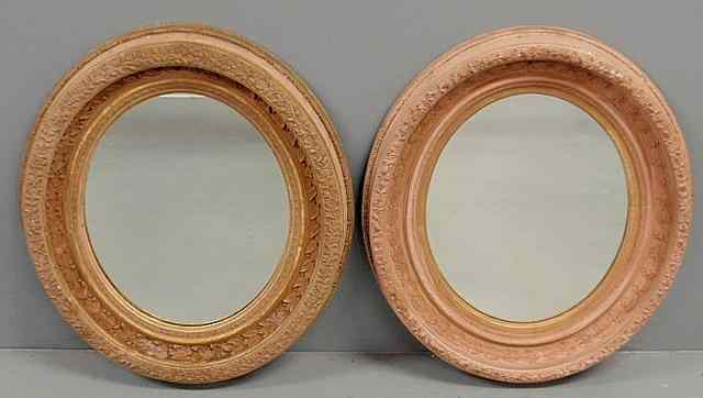 Appraisal: Large pair of molded plaster oval mirrors th c with