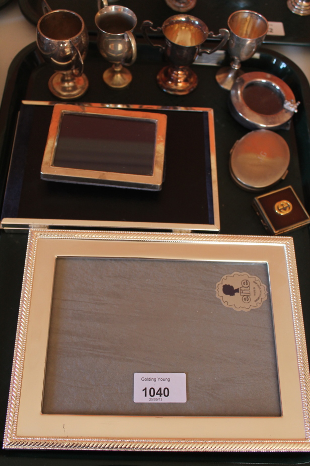 Appraisal: A silver photograph frame and others with miniature prize cups