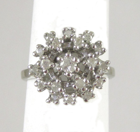 Appraisal: DIAMOND AND TEN KARAT WHITE GOLD CLUSTER RING set with