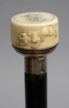 Appraisal: JAPANESE CARVED IVORY-HANDLED STAINED WOOD WALKING STICK The ring handle