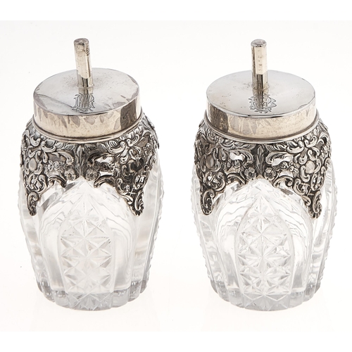 Appraisal: A pair of Edwardian silver mounted cut glass gum pots