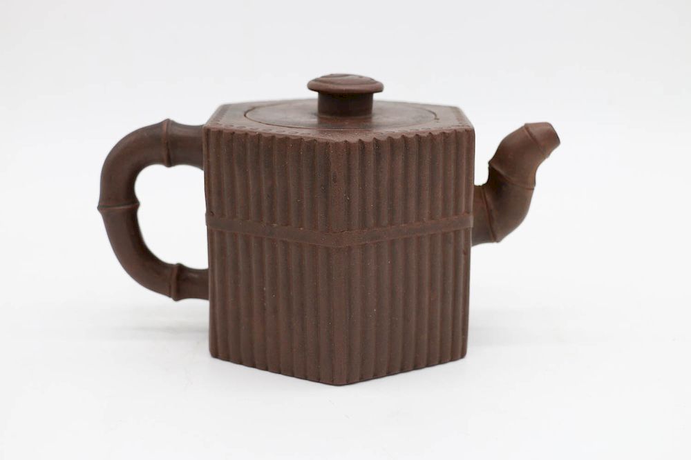 Appraisal: YIXING HEXAGON TEAPOT of hexagon shape imitates Bamboo form The