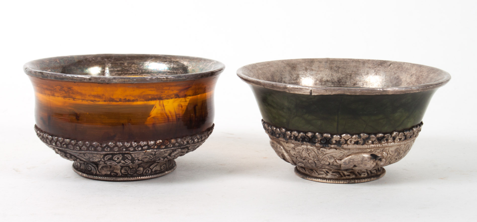 Appraisal: Two Tibetan silver-mounted bowls late th early th century amber