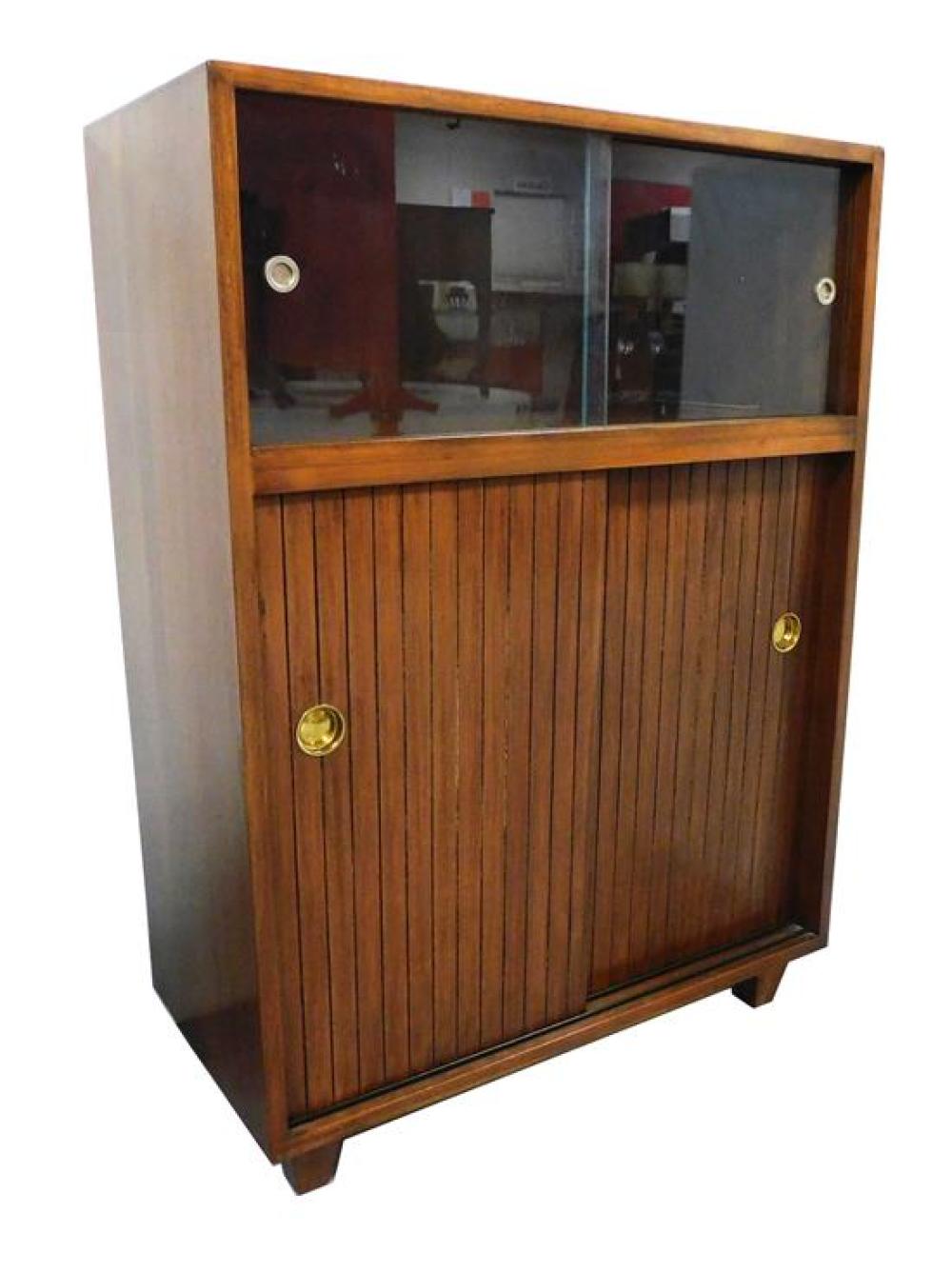 Appraisal: Mid-century cabinet with two glass sliding doors over two wood