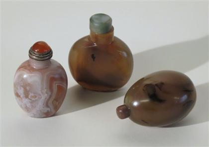 Appraisal: Three Chinese carved agate snuff bottles th th century