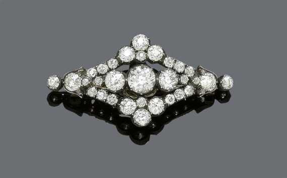 Appraisal: DIAMOND BROOCH ca Silver over red gold Decorative lozenge-shaped brooch