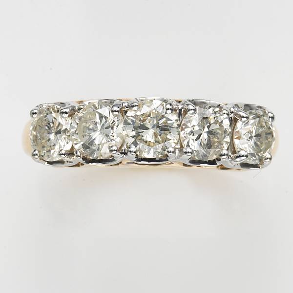 Appraisal: A diamond and fourteen karat gold five stone ring estimated