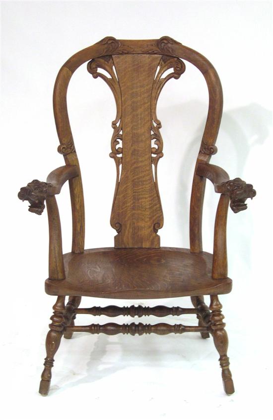 Appraisal: Oak armchair with snarling animal head hand rests foliate carving