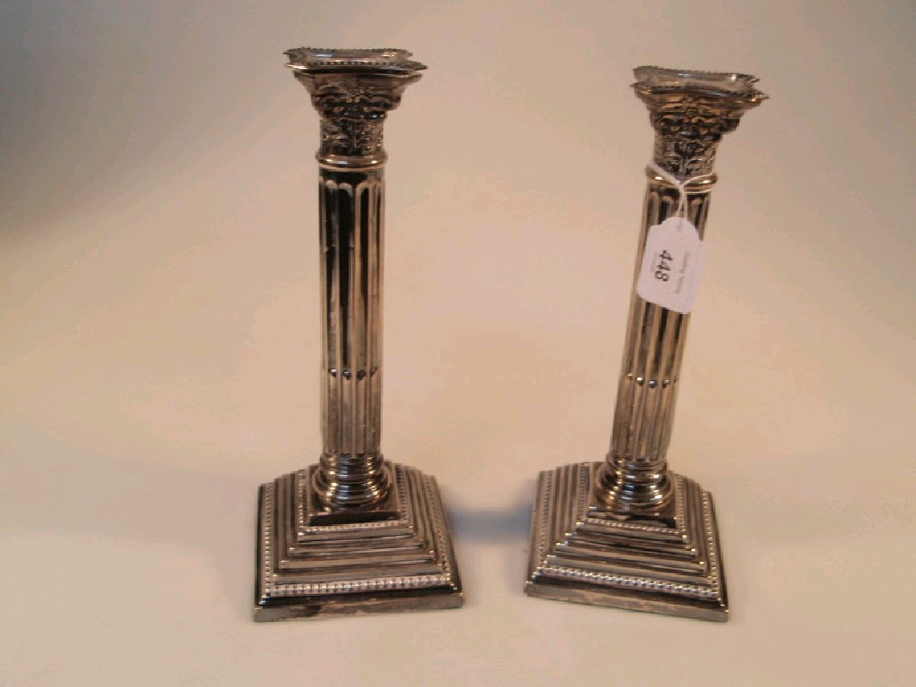 Appraisal: A pair of Edwardian silver table candlesticks of classical Corinthian