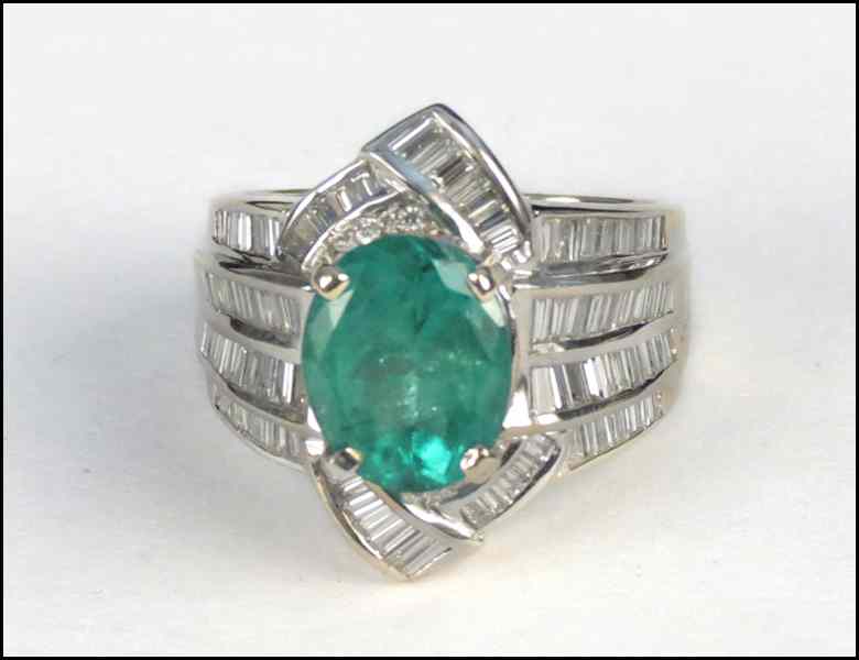 Appraisal: EMERALD DIAMOND AND KARAT WHITE GOLD RING Oval emerald is