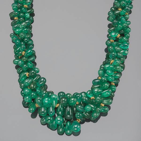 Appraisal: An emerald diamond and k gold three strand torsade necklace