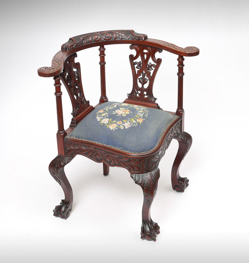 Appraisal: CHIPPENDALE STYLE CARVED CORNER CHAIR Carved top rail shaped back