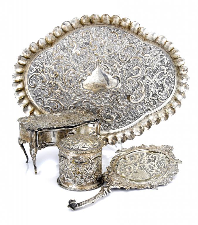 Appraisal: AN EDWARD VII DRESSING TABLE TRAY richly embossed with flowers