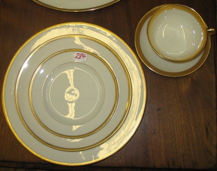 Appraisal: A PARTIAL SET OF LENOX PORCELAIN DINNERWARE pieces gold banded